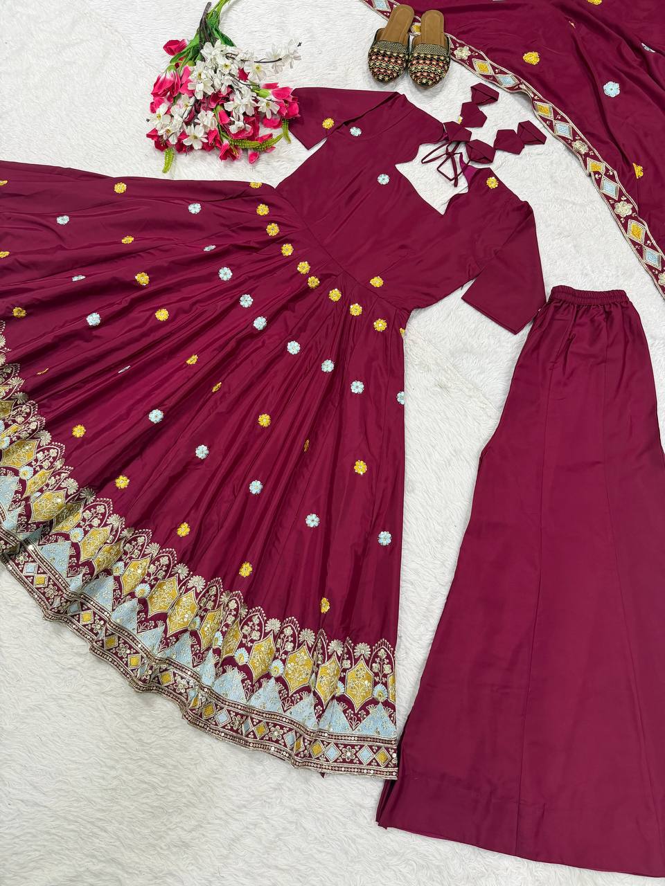 Majestic Wine Flared Anarkali Suit Set Adorned with Delicate Floral Scattered Motifs and an Ornate Heritage Embroidered Border